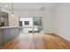 Bright open living space with hardwood flooring, a kitchen island, recessed lighting and oversized windows at 367 Parkway Ne Dr # 5, Atlanta, GA 30312