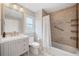 Nicely appointed bathroom featuring a vanity, toilet and shower-tub combination at 5365 Glenhaven Dr, Cumming, GA 30041