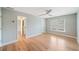 Airy bedroom with a view of the en suite and light-toned laminate floors at 5365 Glenhaven Dr, Cumming, GA 30041
