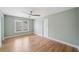 Spacious bedroom with modern ceiling fan and natural light from a window at 5365 Glenhaven Dr, Cumming, GA 30041