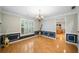 Traditional dining room boasting beautiful hardwood floors and chair rail, enhanced by natural light at 5365 Glenhaven Dr, Cumming, GA 30041