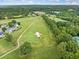 Aerial view of a scenic golf course, surrounded by upscale homes and lush greenery at 5365 Glenhaven Dr, Cumming, GA 30041
