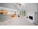 Bright living room features a fireplace, cathedral ceiling, carpet flooring and large windows at 5365 Glenhaven Dr, Cumming, GA 30041