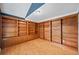 Home office featuring hardwood floors, built-in shelving, and a unique sloped ceiling at 5365 Glenhaven Dr, Cumming, GA 30041