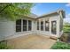 Exterior view of a sunroom and patio with view of beautifully landscaped backyard at 5365 Glenhaven Dr, Cumming, GA 30041