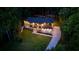 Aerial view of a home at dusk with professional lighting and a well maintained green lawn at 942 Fairfield, Marietta, GA 30068