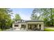 Spacious backyard featuring a patio with fireplace and seating, and manicured lawn at 942 Fairfield, Marietta, GA 30068