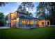 Expansive backyard view of this luxurious home featuring a covered patio and well-manicured lawn at 942 Fairfield, Marietta, GA 30068