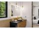 Elegant bathroom with a stone vessel sink, custom cabinetry, and an illuminated mirror at 942 Fairfield, Marietta, GA 30068