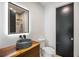 Modern bathroom with an illuminated mirror, unique vessel sink, and tiled shower at 942 Fairfield, Marietta, GA 30068