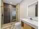 Bathroom featuring updated shower, modern vanity, and sleek, well-lit mirror at 942 Fairfield, Marietta, GA 30068