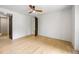 Airy bedroom features pale hardwood floors and an ensuite bathroom, providing added convenience at 942 Fairfield, Marietta, GA 30068