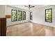 Bright bedroom with large windows offering beautiful views, a ceiling fan, and hardwood floors at 942 Fairfield, Marietta, GA 30068