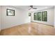 Cozy bedroom with hardwood floors, large windows offering natural light, and a ceiling fan at 942 Fairfield, Marietta, GA 30068