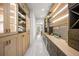 Spacious butler's pantry with custom cabinets, wine storage, and convenient access to other areas of the home at 942 Fairfield, Marietta, GA 30068