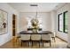 Elegant dining room featuring a modern light fixture, neutral decor, and hardwood floors at 942 Fairfield, Marietta, GA 30068