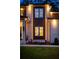 Modern home exterior featuring sleek lines, well-lit windows, and manicured landscaping at 942 Fairfield, Marietta, GA 30068