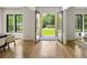 Bright foyer showcasing hardwood floors, black-framed glass doors, and large windows at 942 Fairfield, Marietta, GA 30068