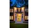 Inviting front entrance with ambient lighting, modern design, and well-maintained lawn at 942 Fairfield, Marietta, GA 30068