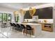 Stylish kitchen featuring a large island with counter seating and modern pendant lighting above the island at 942 Fairfield, Marietta, GA 30068