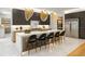 Stunning kitchen featuring a waterfall island, modern pendant lighting, and stainless steel appliances at 942 Fairfield, Marietta, GA 30068