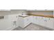 Functional laundry room with white cabinetry, wood countertops, and modern fixtures at 942 Fairfield, Marietta, GA 30068