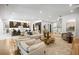 Spacious and modern open-concept living room with sleek finishes, seamlessly connected to a stunning gourmet kitchen at 942 Fairfield, Marietta, GA 30068