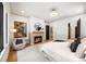 Relaxing main bedroom with a cozy fireplace, comfortable seating, and natural light at 942 Fairfield, Marietta, GA 30068