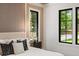 Bright main bedroom showcasing stylish design, large windows, and a peaceful atmosphere at 942 Fairfield, Marietta, GA 30068