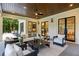 Beautiful patio with comfortable seating, ceiling fan, and an entrance to the house at 942 Fairfield, Marietta, GA 30068