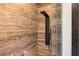 Modern shower featuring sleek fixtures and natural wood-look tile at 942 Fairfield, Marietta, GA 30068
