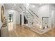 Modern staircase with glass railings, wood treads, and recessed lighting at 942 Fairfield, Marietta, GA 30068