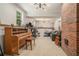 Recreational basement featuring a piano, guitars, and a cozy seating area, perfect for entertainment at 1031 Bailey Rd, Woodstock, GA 30188