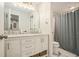 Bright bathroom with a double sink vanity, marble countertop, and a separate toilet and shower area at 1031 Bailey Rd, Woodstock, GA 30188