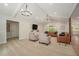 Spacious living room with ample seating, neutral carpet, white ceiling beams, and plenty of natural light at 1031 Bailey Rd, Woodstock, GA 30188