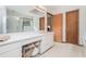 Bright bathroom with a soaking tub, a glass-enclosed shower, and plenty of storage at 225 W Union Grove Cir, Auburn, GA 30011