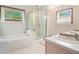 Relaxing bathroom with a soaking tub and a separate glass-enclosed shower at 225 W Union Grove Cir, Auburn, GA 30011