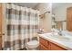 Clean bathroom with a shower-tub combination and modern fixtures, offering a functional space at 225 W Union Grove Cir, Auburn, GA 30011
