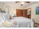 Inviting bedroom with a floral-patterned bedspread and a view into another room at 225 W Union Grove Cir, Auburn, GA 30011