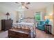 Comfortable bedroom with a decorative bedframe, dresser, and a relaxing sitting area at 225 W Union Grove Cir, Auburn, GA 30011