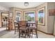 Cozy dining area with large windows offering scenic views at 225 W Union Grove Cir, Auburn, GA 30011