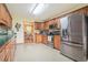 Spacious kitchen featuring wood cabinets and stainless steel appliances at 225 W Union Grove Cir, Auburn, GA 30011