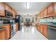 Bright eat-in kitchen with wood cabinets and stainless appliances at 225 W Union Grove Cir, Auburn, GA 30011