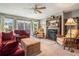 Inviting living room featuring a fireplace, large windows, and cozy seating for a relaxing atmosphere at 225 W Union Grove Cir, Auburn, GA 30011