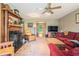 Inviting living room with a cozy fireplace, plush seating, and a view to the yard at 225 W Union Grove Cir, Auburn, GA 30011