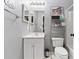 Well-lit bathroom features a modern vanity and plenty of storage space at 242 Sandhurst Ct, Suwanee, GA 30024