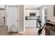 Kitchenette area with white cabinetry, granite countertops, microwave, and stainless sink at 242 Sandhurst Ct, Suwanee, GA 30024