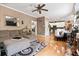 Open concept living room with hardwood floors, stylish decor, and seamless flow to the kitchen at 242 Sandhurst Ct, Suwanee, GA 30024