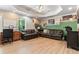 Spacious living room with recessed lighting and hardwood flooring offers a comfortable seating area at 242 Sandhurst Ct, Suwanee, GA 30024
