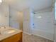 Bright bathroom featuring tile flooring, dual vanity sink, and a bathtub shower at 2918 Pavia Circle, Austell, GA 30106